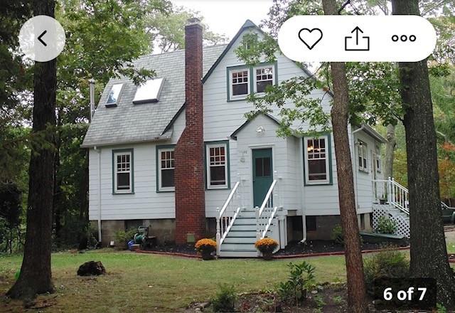 46 Satinwood Rd, Rocky Point, NY 11778 - view of front of house featuring a chimney and a front lawn