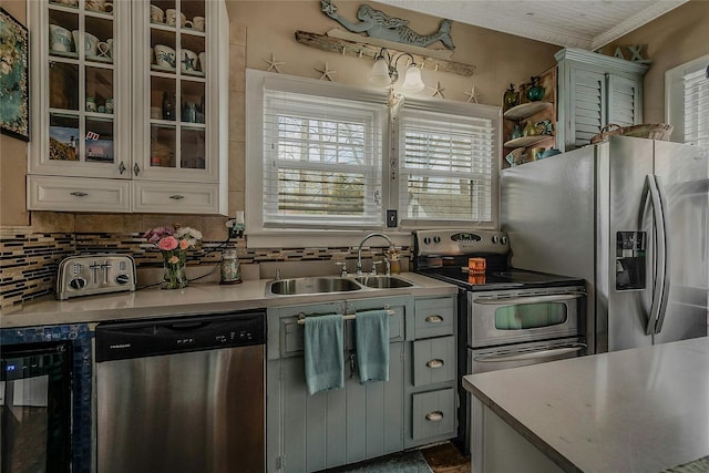 46 Satinwood Rd, Rocky Point, NY 11778 - kitchen featuring stainless steel appliances, plenty of natural light, beverage cooler, decorative backsplash, and ornamental molding