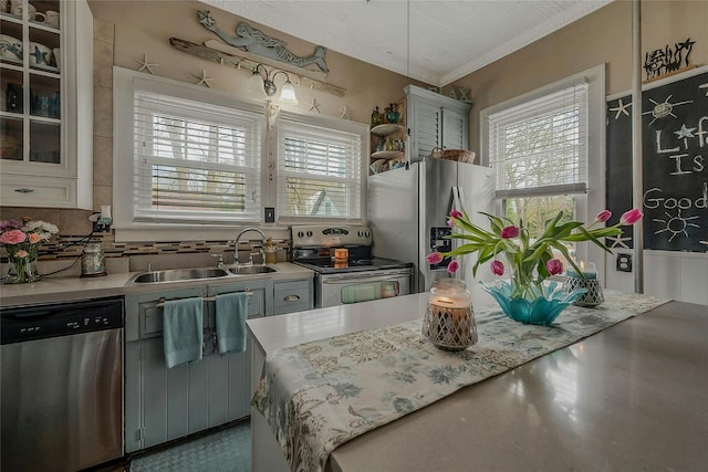 46 Satinwood Rd, Rocky Point, NY 11778 - kitchen featuring stainless steel appliances, plenty of natural light, light countertops, crown molding, and backsplash