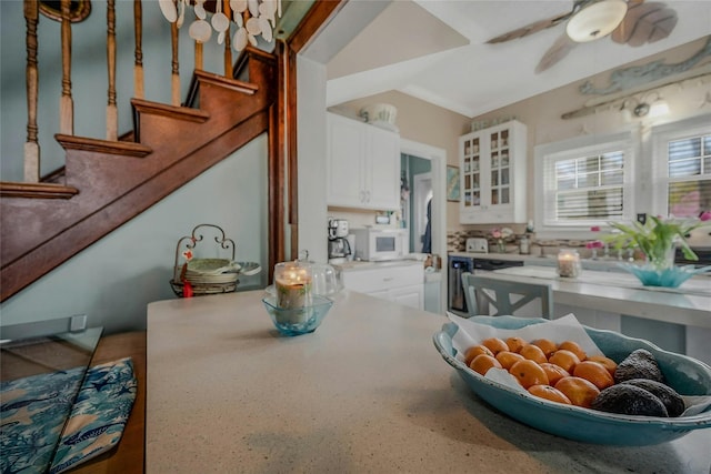 46 Satinwood Rd, Rocky Point, NY 11778 - kitchen featuring white microwave, glass insert cabinets, white cabinets, and a ceiling fan