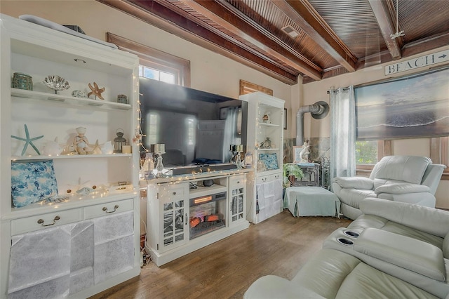 46 Satinwood Rd, Rocky Point, NY 11778 - living room with wood finished floors, healthy amount of natural light, and a wood ceiling with exposed beams