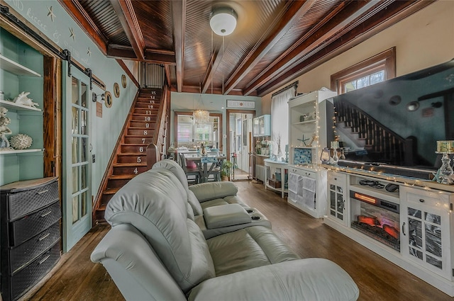46 Satinwood Rd, Rocky Point, NY 11778 - living area featuring stairs, wood finished floors, a wooden ceiling with exposed beams, and a barn door