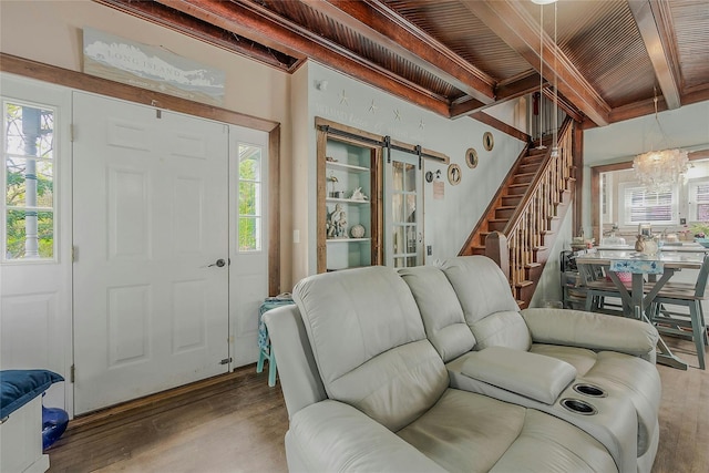 46 Satinwood Rd, Rocky Point, NY 11778 - living room with stairs, wood finished floors, a wooden ceiling with exposed beams, healthy amount of natural light, and a barn door