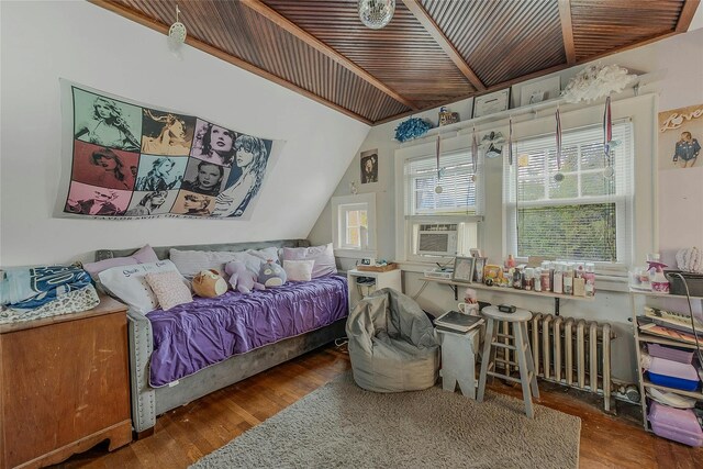 46 Satinwood Rd, Rocky Point, NY 11778 - bedroom with wood finished floors, lofted ceiling, and radiator