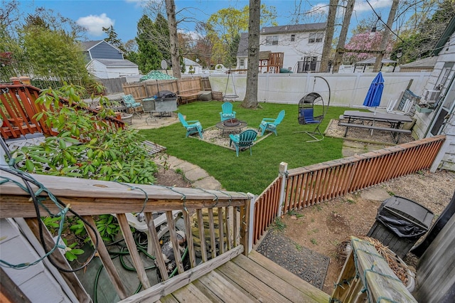 46 Satinwood Rd, Rocky Point, NY 11778 - fenced backyard with a fire pit and a patio area