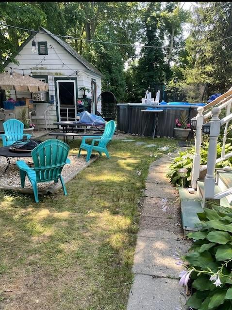 46 Satinwood Rd, Rocky Point, NY 11778 - view of grassy yard with an outdoor pool