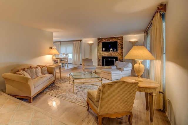 21629 28th Ave, Bayside, NY 11360 - living room with a stone fireplace and wood finished floors