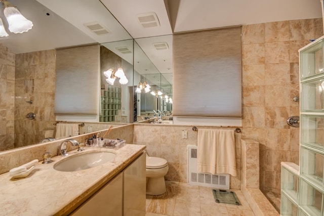21629 28th Ave, Bayside, NY 11360 - full bathroom featuring visible vents, tile walls, vanity, toilet, and tiled shower
