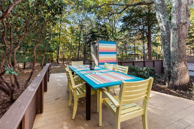 exterior space with fence and outdoor dining space