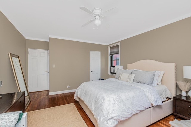 bedroom featuring ornamental molding, baseboards, a ceiling fan, and wood finished floors