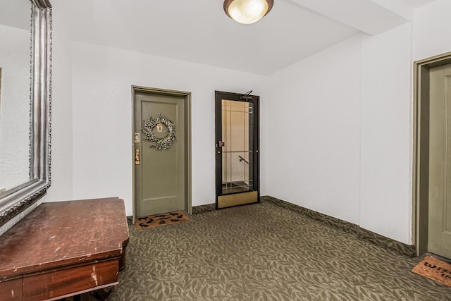 interior space with dark colored carpet