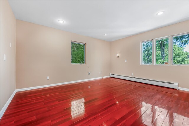 96 Mulberry Ave, Garden City, NY 11530 - unfurnished room with a baseboard radiator, wood finished floors, baseboards, and recessed lighting