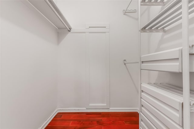 96 Mulberry Ave, Garden City, NY 11530 - walk in closet featuring wood finished floors