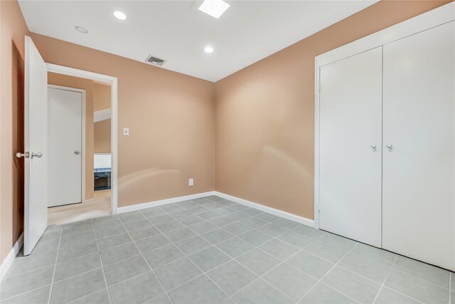 96 Mulberry Ave, Garden City, NY 11530 - unfurnished bedroom with recessed lighting, baseboards, and a closet