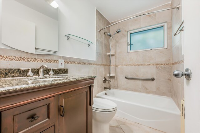 96 Mulberry Ave, Garden City, NY 11530 - bathroom featuring vanity, bathing tub / shower combination, toilet, and tile walls
