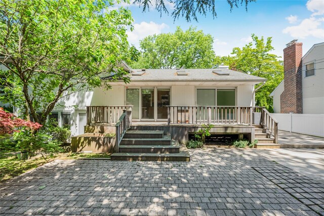 96 Mulberry Ave, Garden City, NY 11530 - rear view of property featuring a patio area and a deck