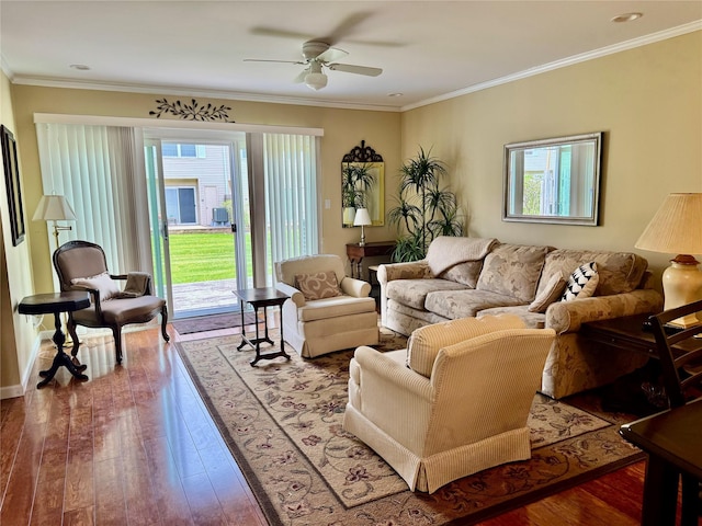 living area with a ceiling fan, crown molding, and wood-type flooring