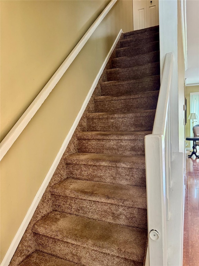 stairs featuring baseboards