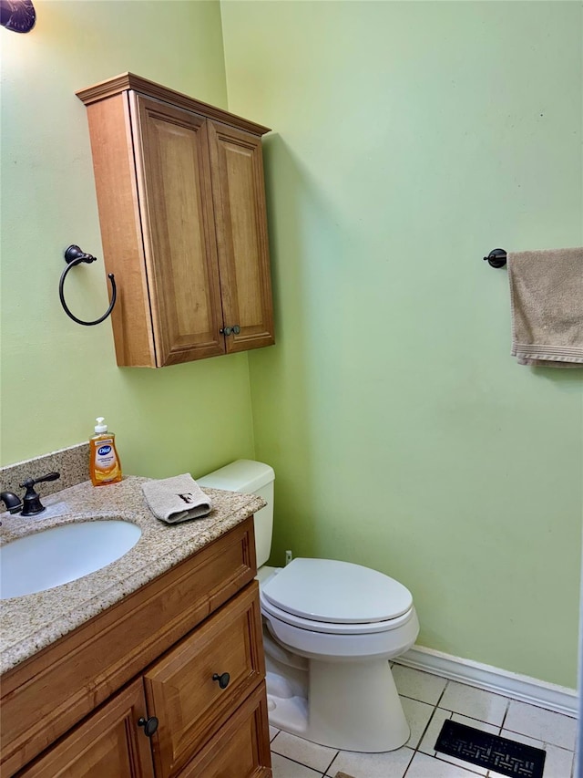 bathroom with tile patterned floors, toilet, and vanity