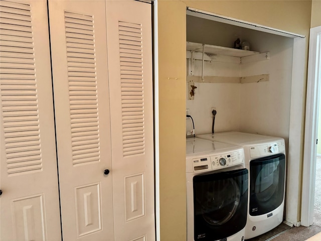 washroom featuring washer and dryer and laundry area