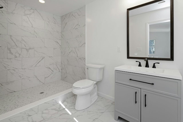 21 Kent Rd, Hopewell Junction, NY 12533 - bathroom with baseboards, toilet, vanity, marble finish floor, and tiled shower