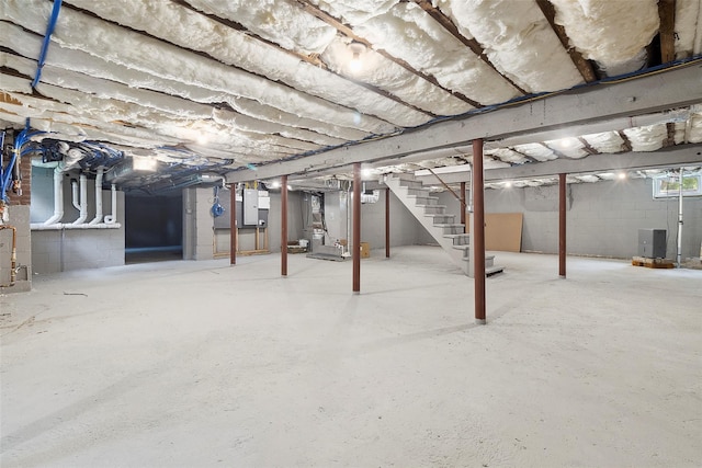 53 Jay St, Katonah, NY 10536 - unfinished below grade area with electric panel, stairs, and heating unit