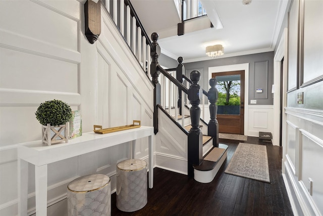 53 Jay St, Katonah, NY 10536 - foyer with a decorative wall, dark wood-type flooring, crown molding, stairway, and wainscoting
