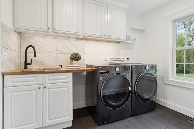 53 Jay St, Katonah, NY 10536 - laundry room with cabinet space, washing machine and dryer, baseboards, and dark wood finished floors