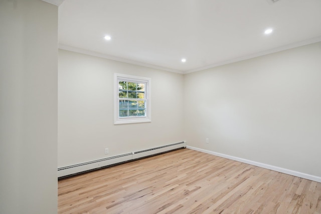 spare room featuring recessed lighting, a baseboard heating unit, and wood finished floors