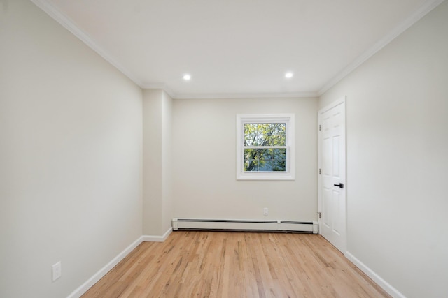 unfurnished room featuring crown molding, light wood finished floors, and a baseboard radiator