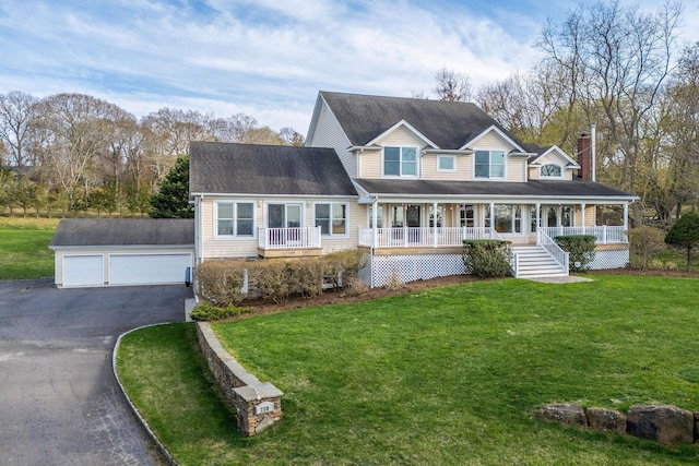250 Naugles Dr, Mattituck, NY 11952 - view of front facade with covered porch, an outbuilding, a front lawn, a chimney, and a garage