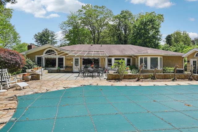 28 Stepping Stone Cres, Dix Hills, NY 11746 - view of swimming pool featuring a covered pool and a patio area