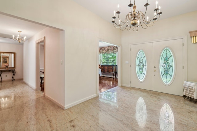 28 Stepping Stone Cres, Dix Hills, NY 11746 - foyer entrance featuring a chandelier, marble finish flooring, baseboards, and french doors