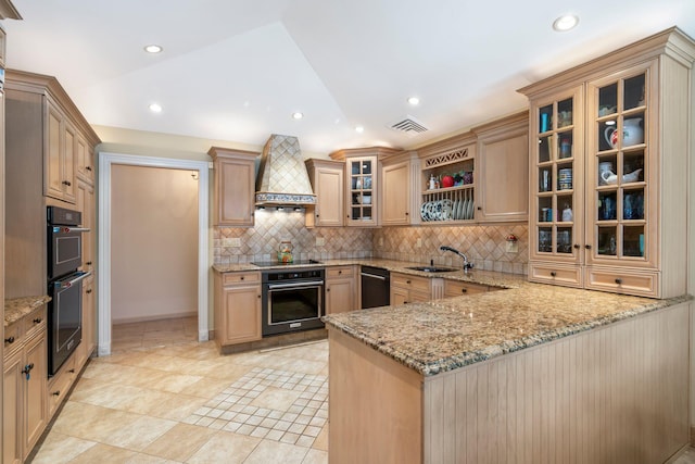 28 Stepping Stone Cres, Dix Hills, NY 11746 - kitchen featuring black appliances, custom exhaust hood, tasteful backsplash, a peninsula, and light stone countertops