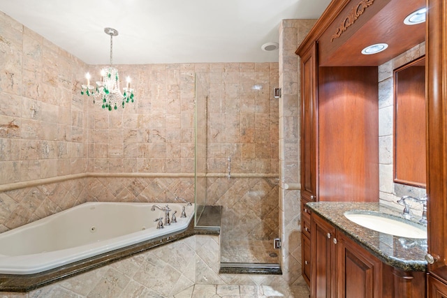 28 Stepping Stone Cres, Dix Hills, NY 11746 - full bath with a jetted tub, a shower stall, vanity, a chandelier, and tile walls