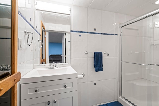 28 Stepping Stone Cres, Dix Hills, NY 11746 - ensuite bathroom featuring tile walls, a shower stall, and vanity