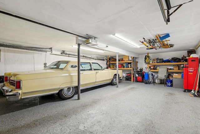 28 Stepping Stone Cres, Dix Hills, NY 11746 - garage featuring a garage door opener and a workshop area