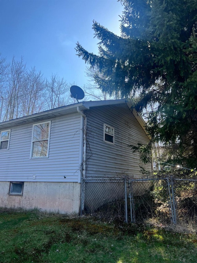 view of property exterior with fence