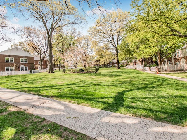 77 Hilltop Acres Unit 77, Yonkers, NY 10704 - surrounding community with fence and a lawn
