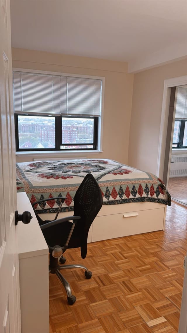 bedroom featuring radiator