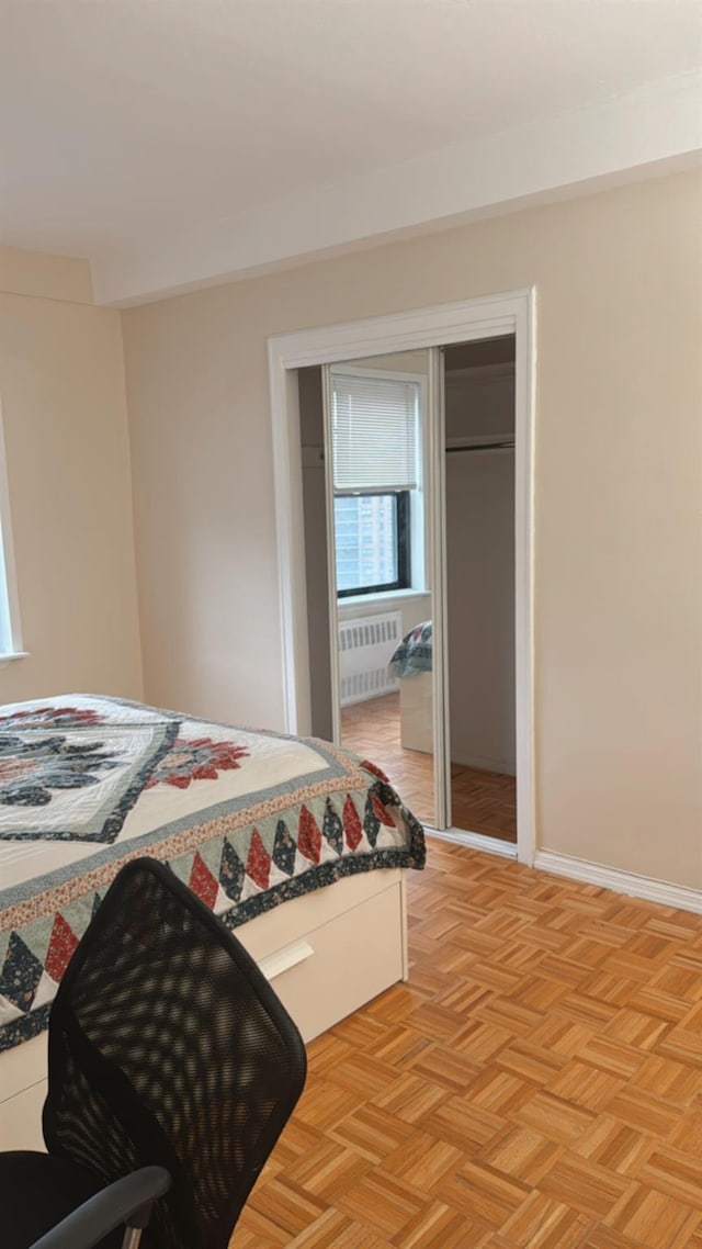 bedroom featuring radiator heating unit