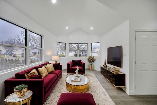living area featuring wood finished floors, recessed lighting, vaulted ceiling, and baseboards