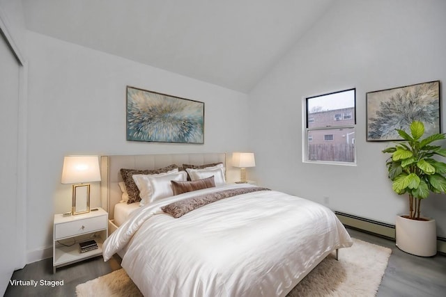 bedroom with wood finished floors, high vaulted ceiling, and a baseboard heating unit