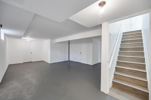finished below grade area featuring stairs