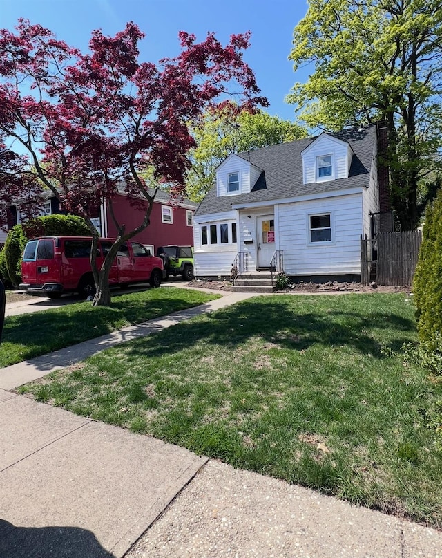 119 Broadfield Rd, Hempstead, NY 11550 - cape cod-style house with fence, roof with shingles, and a front yard