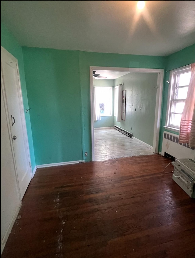 119 Broadfield Rd, Hempstead, NY 11550 - interior space featuring radiator, baseboard heating, wood finished floors, and baseboards