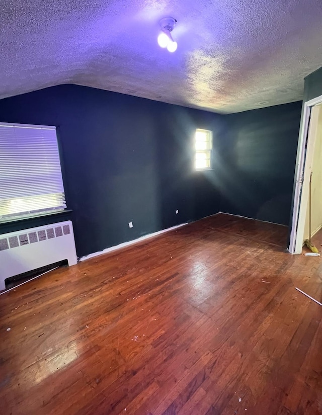 119 Broadfield Rd, Hempstead, NY 11550 - interior space featuring hardwood / wood-style floors, radiator, and a textured ceiling