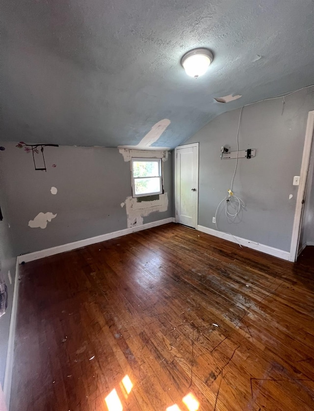 119 Broadfield Rd, Hempstead, NY 11550 - bonus room featuring a textured ceiling, hardwood / wood-style floors, lofted ceiling, and baseboards