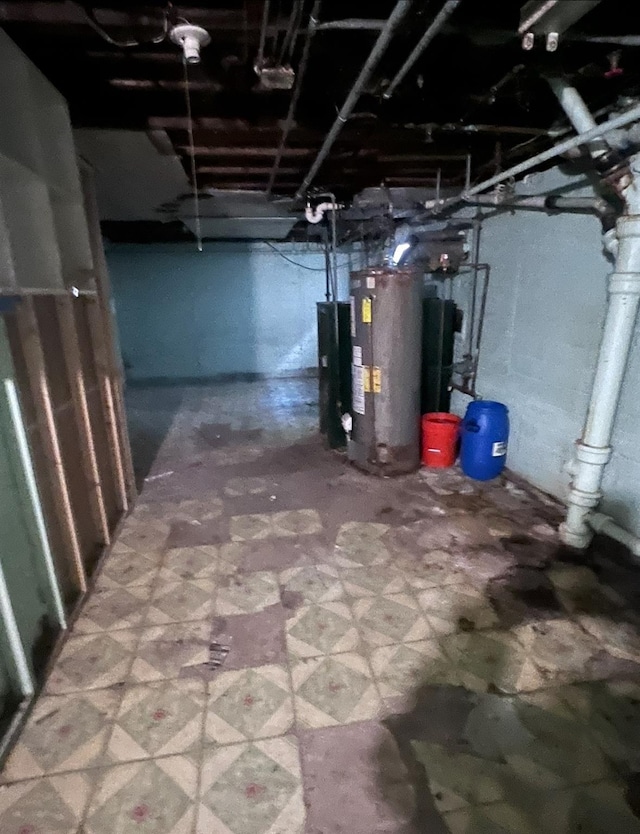 119 Broadfield Rd, Hempstead, NY 11550 - unfinished basement with tile patterned floors and water heater