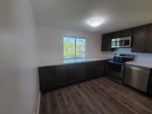 1404 Parr Lake Dr Unit 14D, Newburgh, NY 12550 - kitchen featuring light countertops, appliances with stainless steel finishes, and dark wood-type flooring